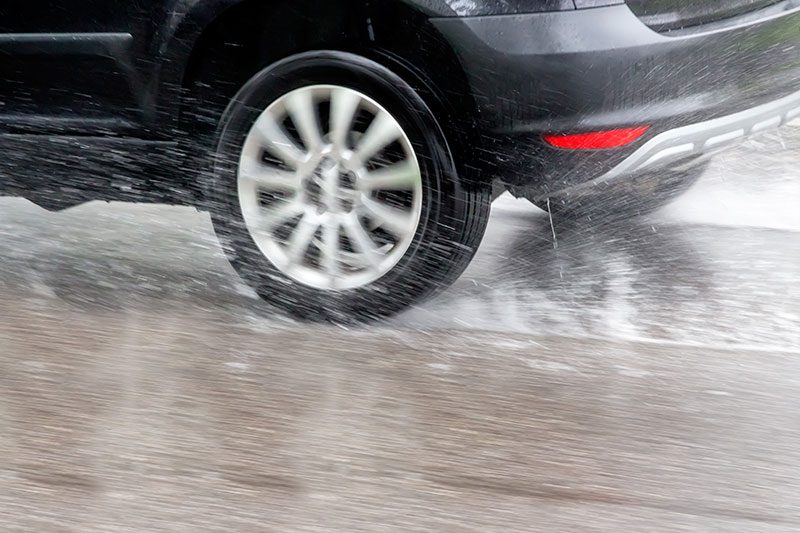 Car going through Large-Puddles (avoiding-a-Car-Accident)